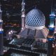 white and blue dome concrete building with 4-towers during night time