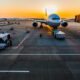 gray airplane on parking