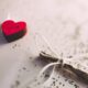 macro shot photography of red and white heart ornament