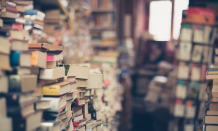 assorted books in shallow focus photography