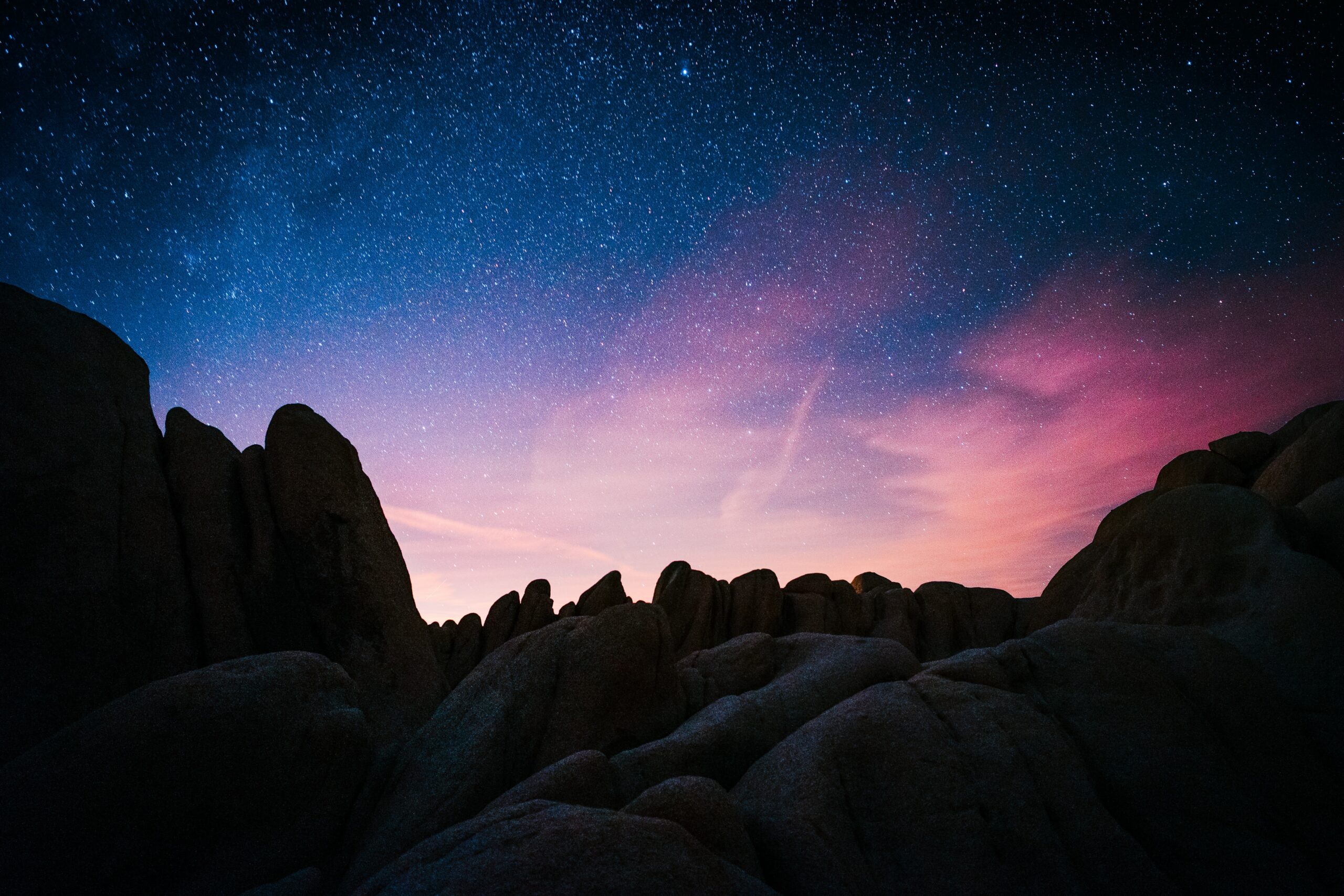 rock mountain during starry night