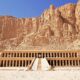 brown wooden fence on white sand during daytime