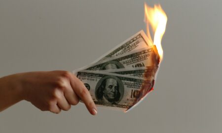burned 100 US dollar banknotes