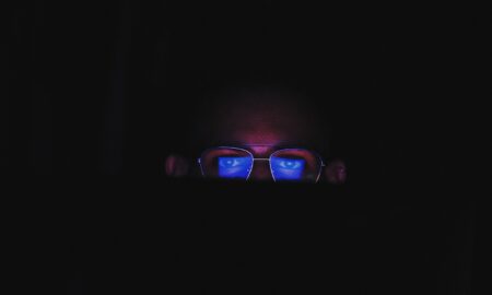 person wearing black framed eyeglasses