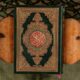 black and red book on brown wooden table