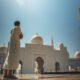 man standing near white mosque