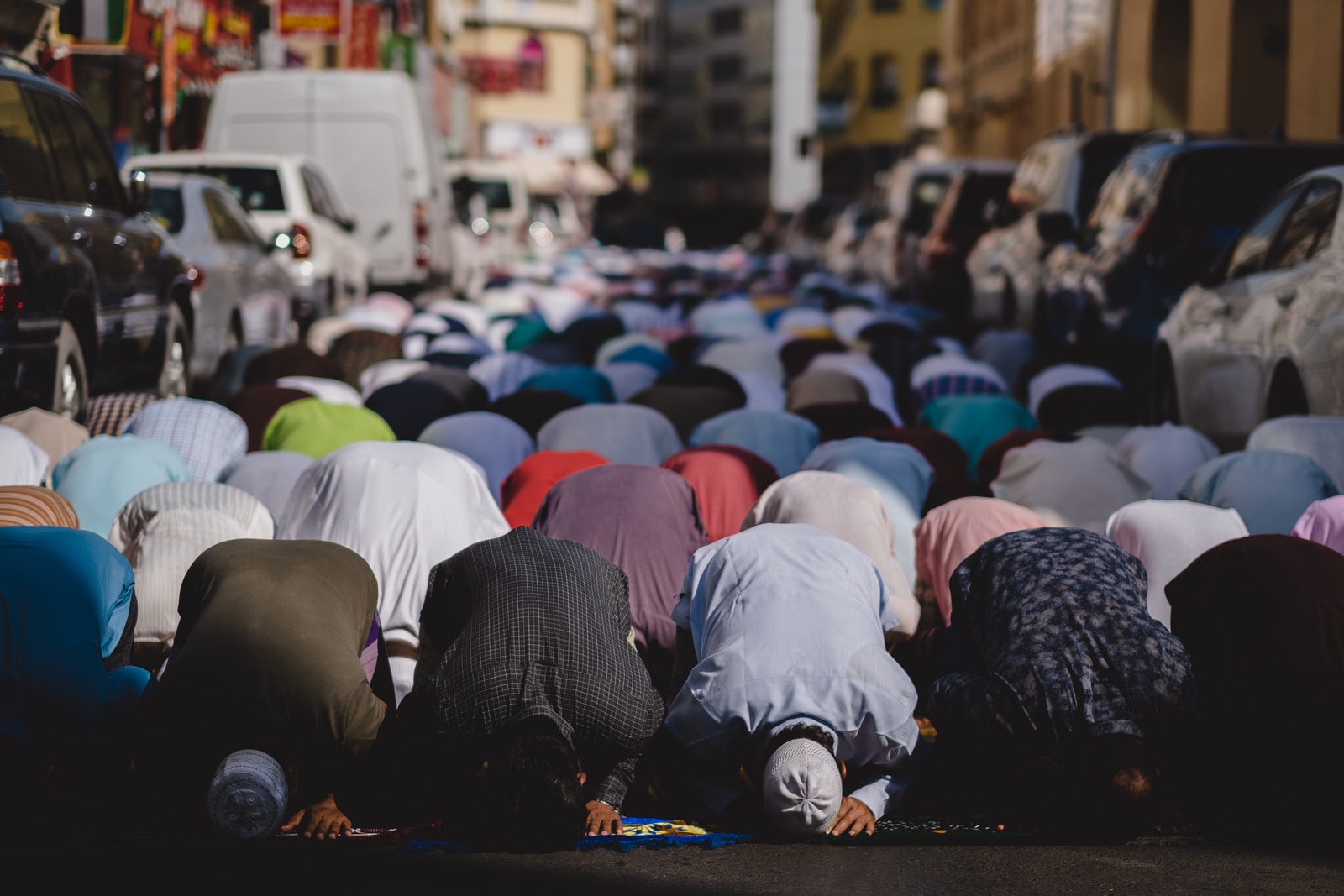 people kneeling and praying during daytime