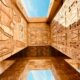 low angle photography of brown concrete building under blue sky during daytime