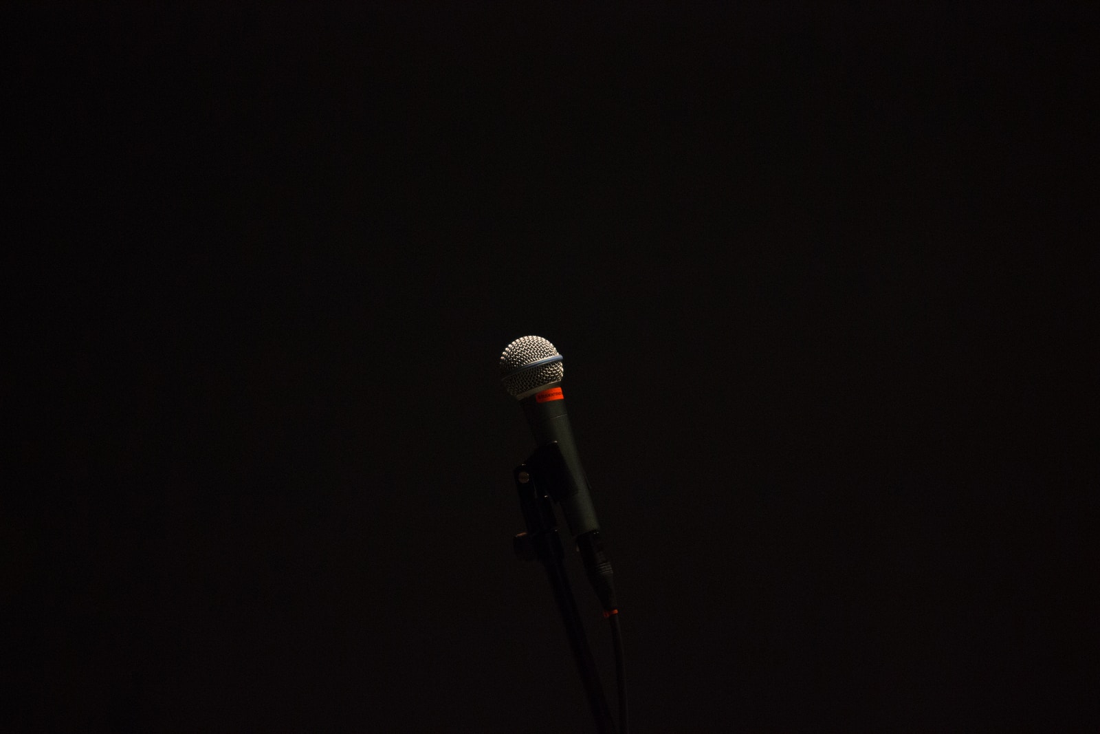 black corded microphone with stand