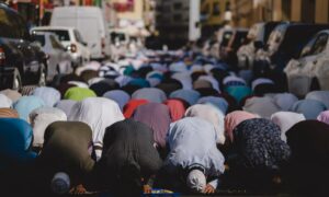 people kneeling and praying during daytime