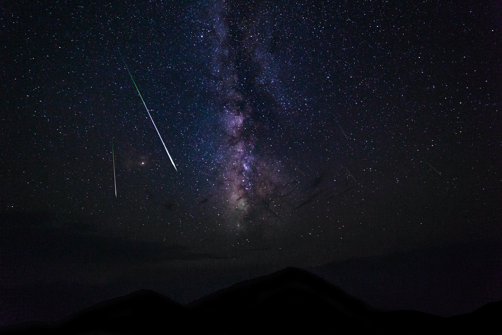 falling stars and milky way galaxy at night