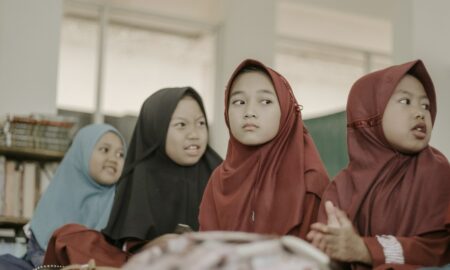 2 women in red hijab