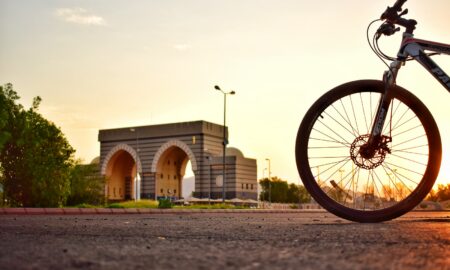 mountain bike on road during golden hour