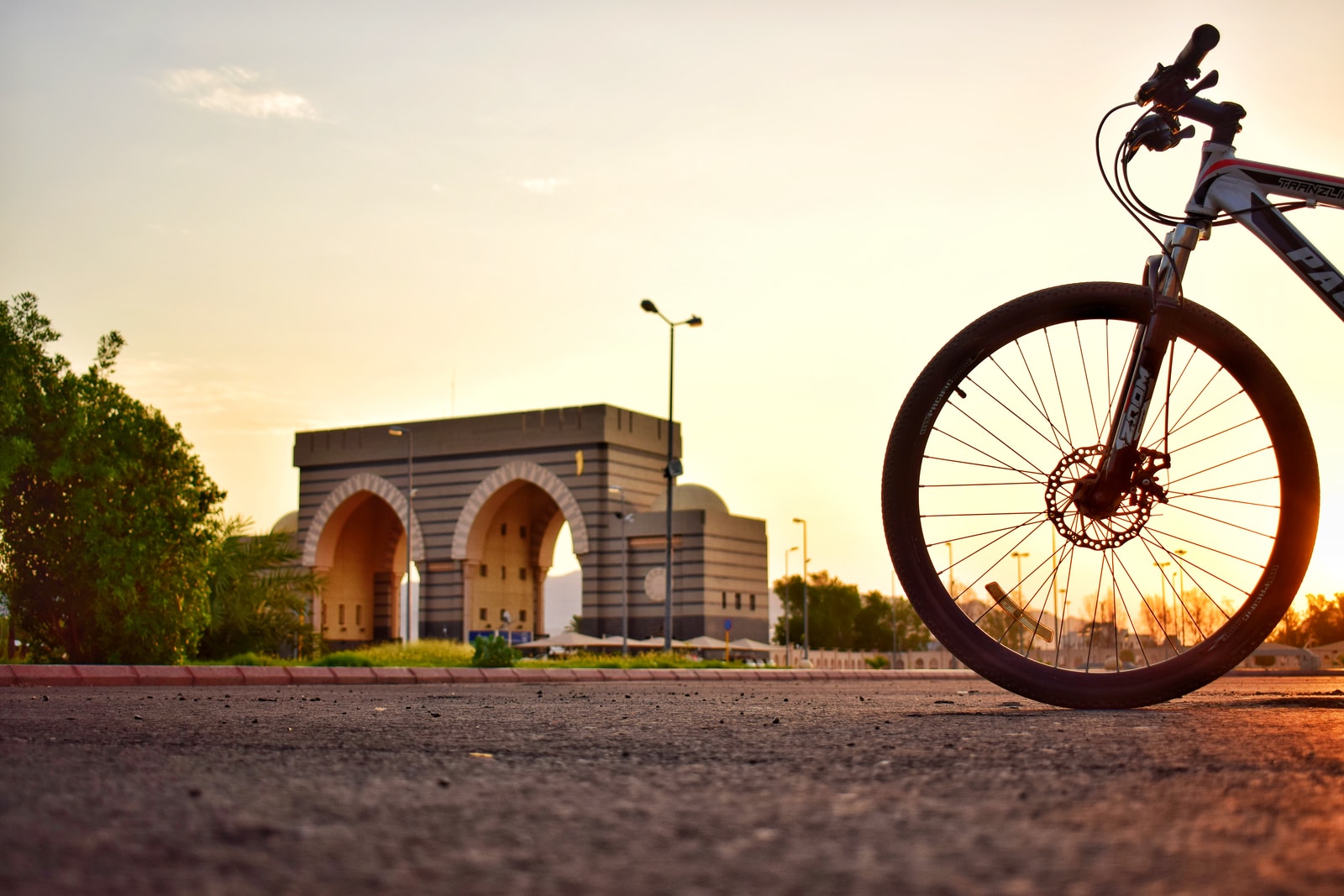 mountain bike on road during golden hour