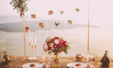 Pink and Red Roses Centerpiece Near Silverwares