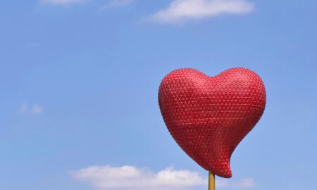 red heart balloon under blue sky during daytime