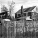 grayscale photo of wooden fence