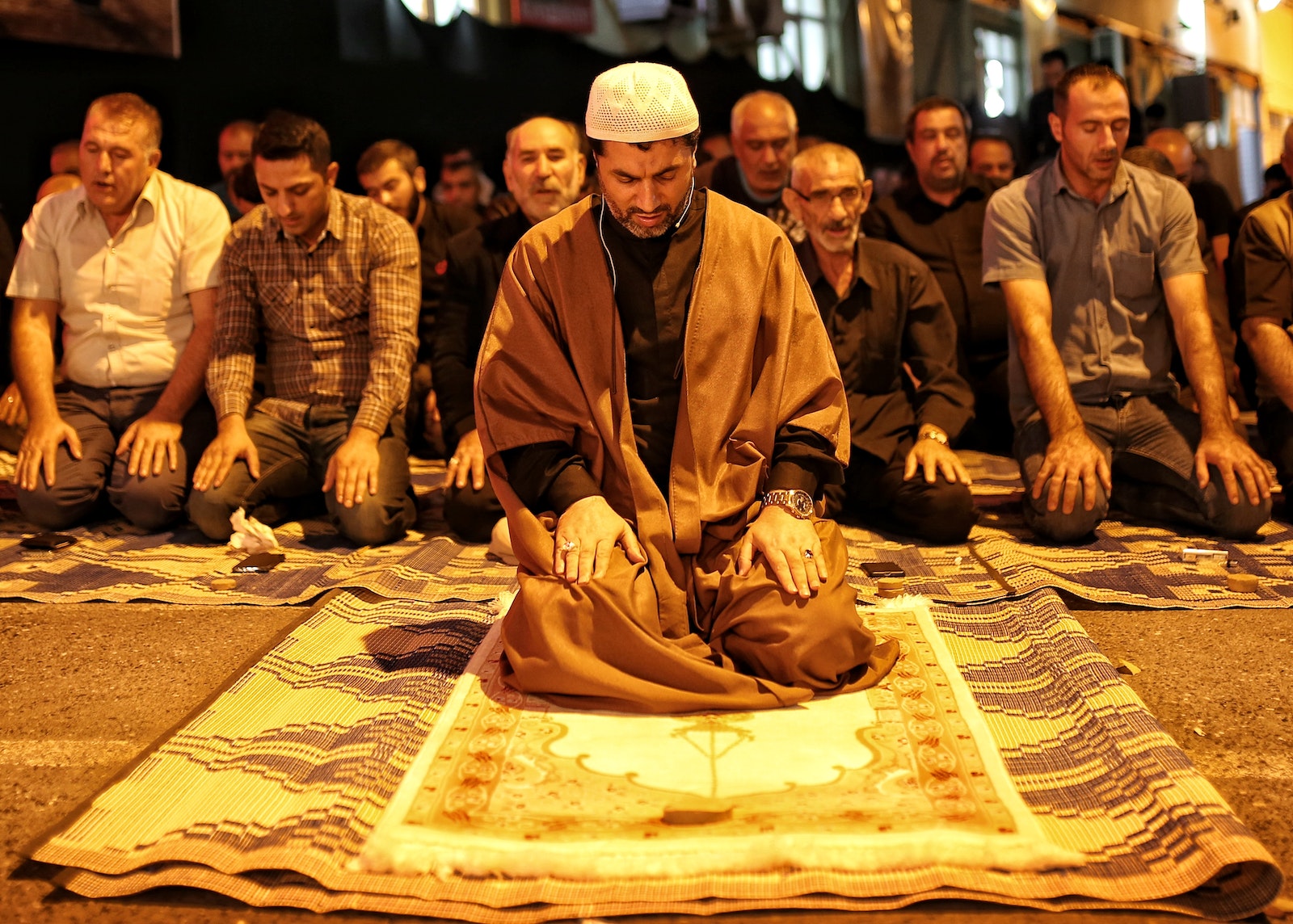 Group of Men Sitting on Floor