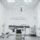 black and white hospital bed in the middle of interior building