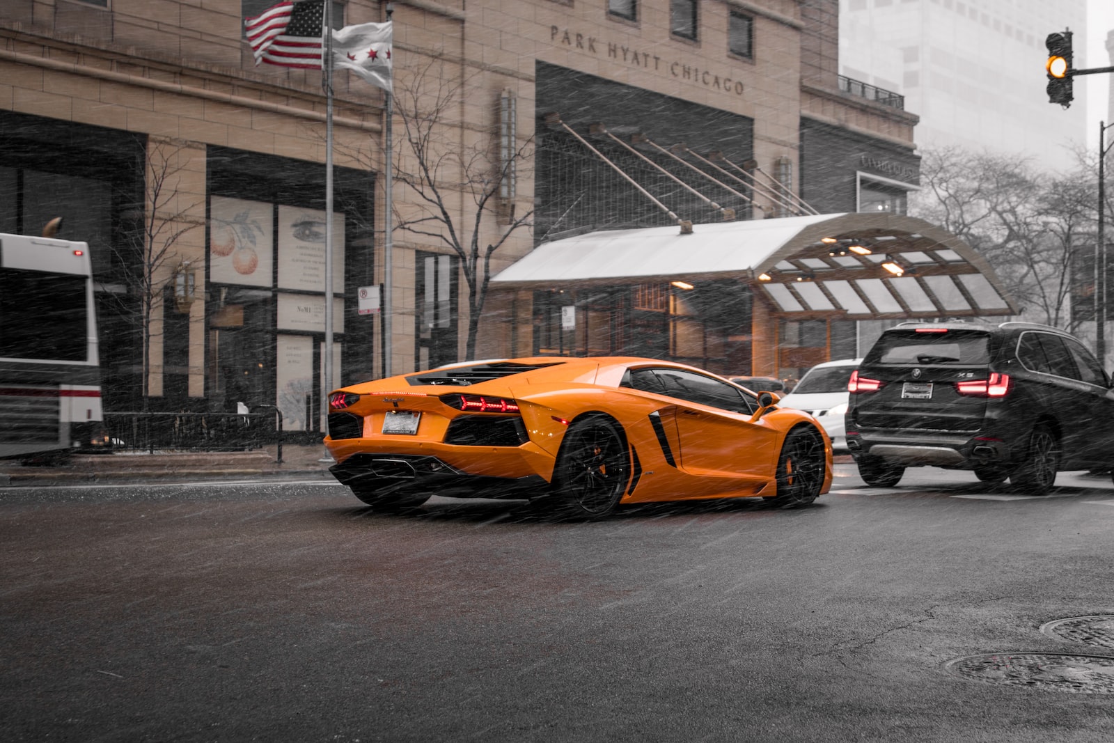 orange coupe on road