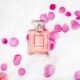 perfume bottle with pink petals