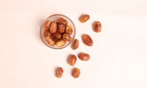 a glass bowl filled with nuts on top of a table