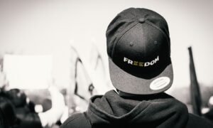 man in black knit cap and black jacket