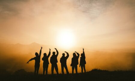 silhouette photo of six persons on top of mountain