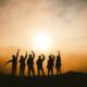 silhouette photo of six persons on top of mountain