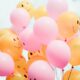 low-angle photo of pink and orange balloons