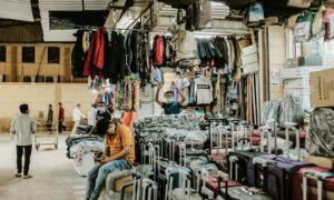 a person sitting in a chair in a shop